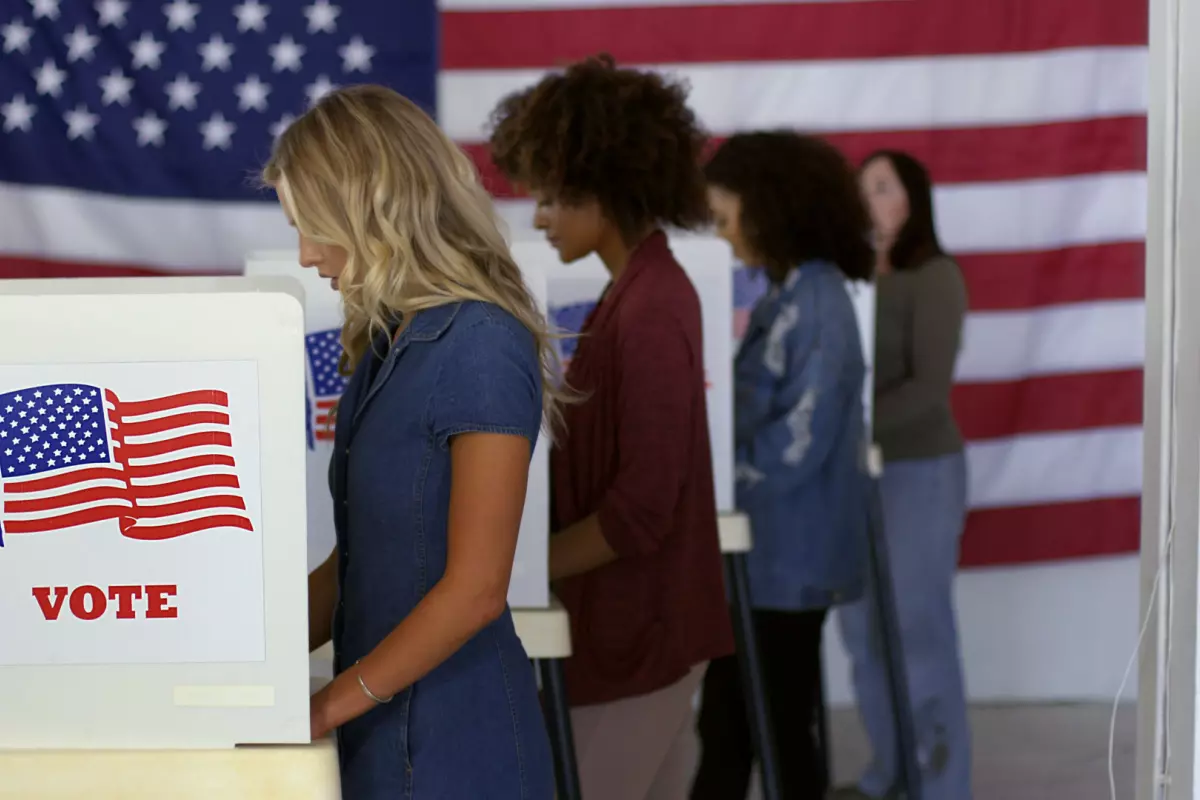 Young adults lined up at ballot booths to vote