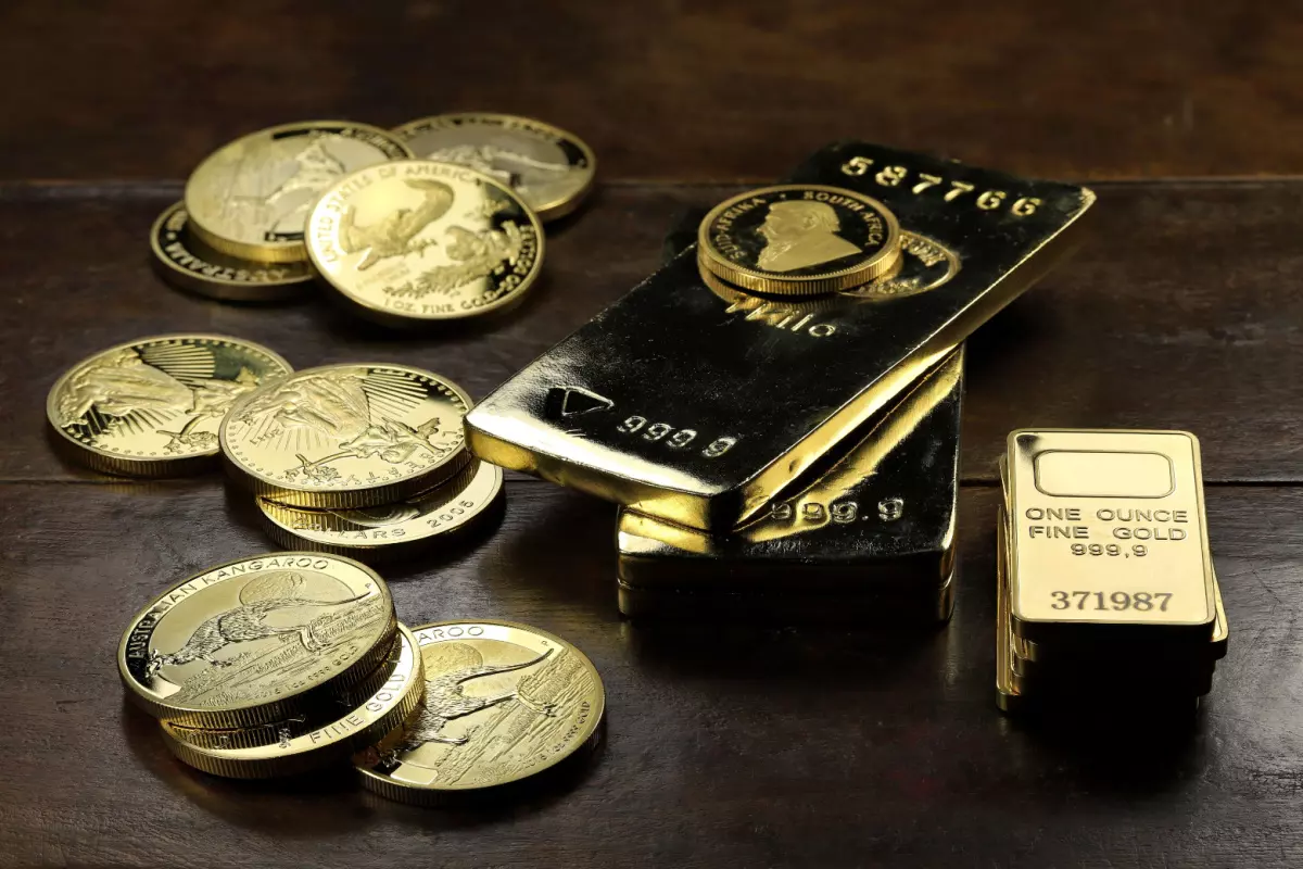 Close up on gold coins and bars for gold IRA