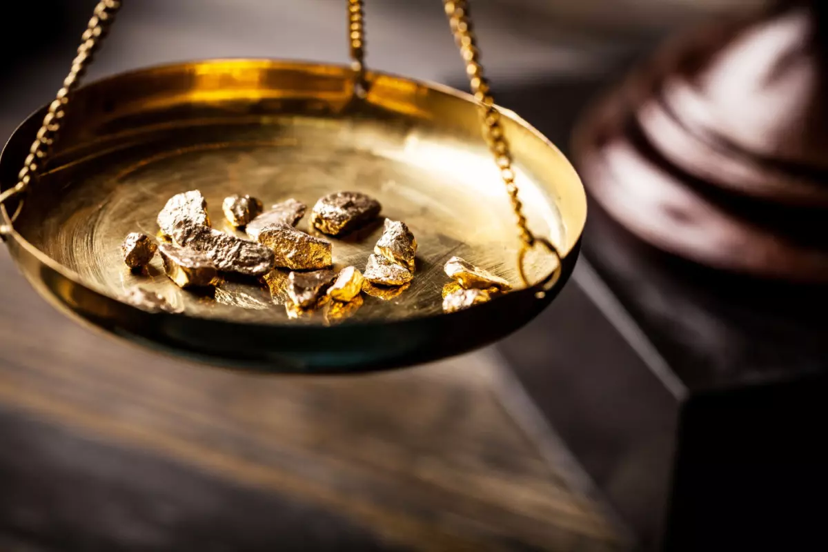 Gold nuggets on scale