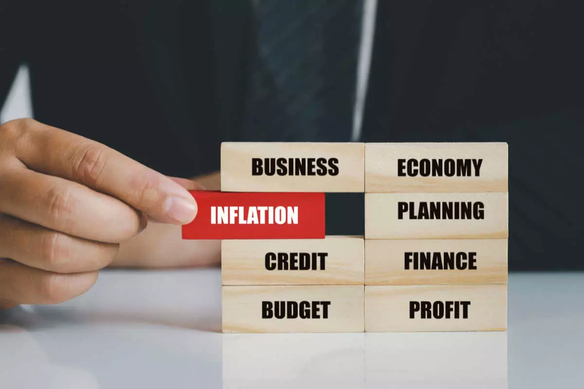 Wooden blocks with text: business, economy, inflation, planning, credit, finance, budget, profit