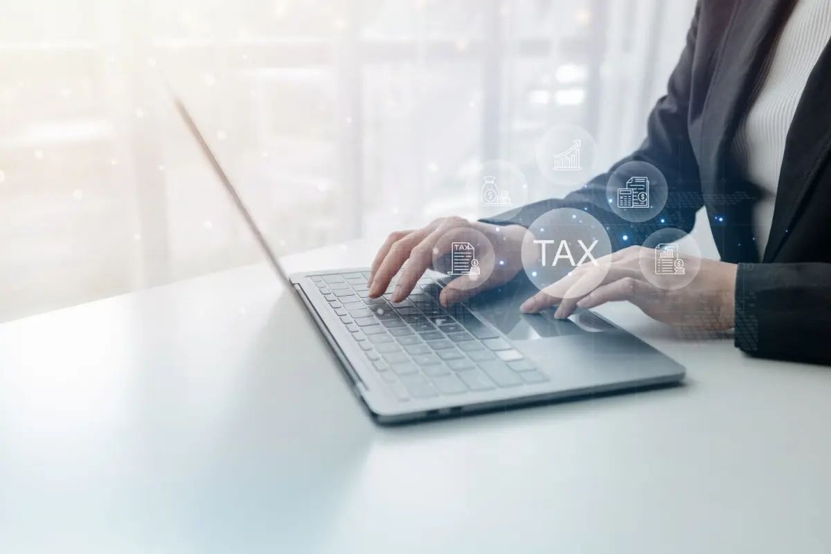 Searching on a laptop for lower tax residency as a tax-saving strategy