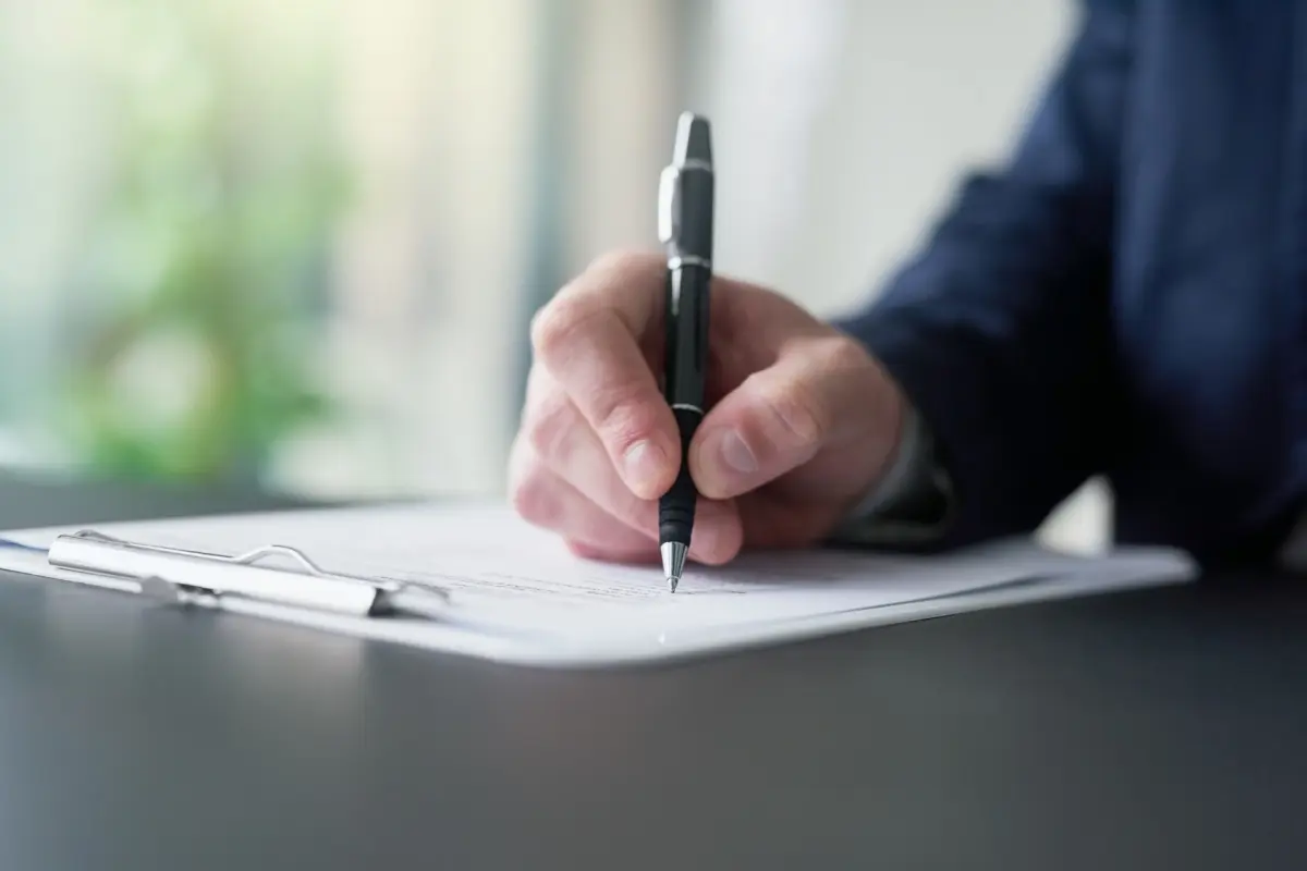 Man writing after retirement